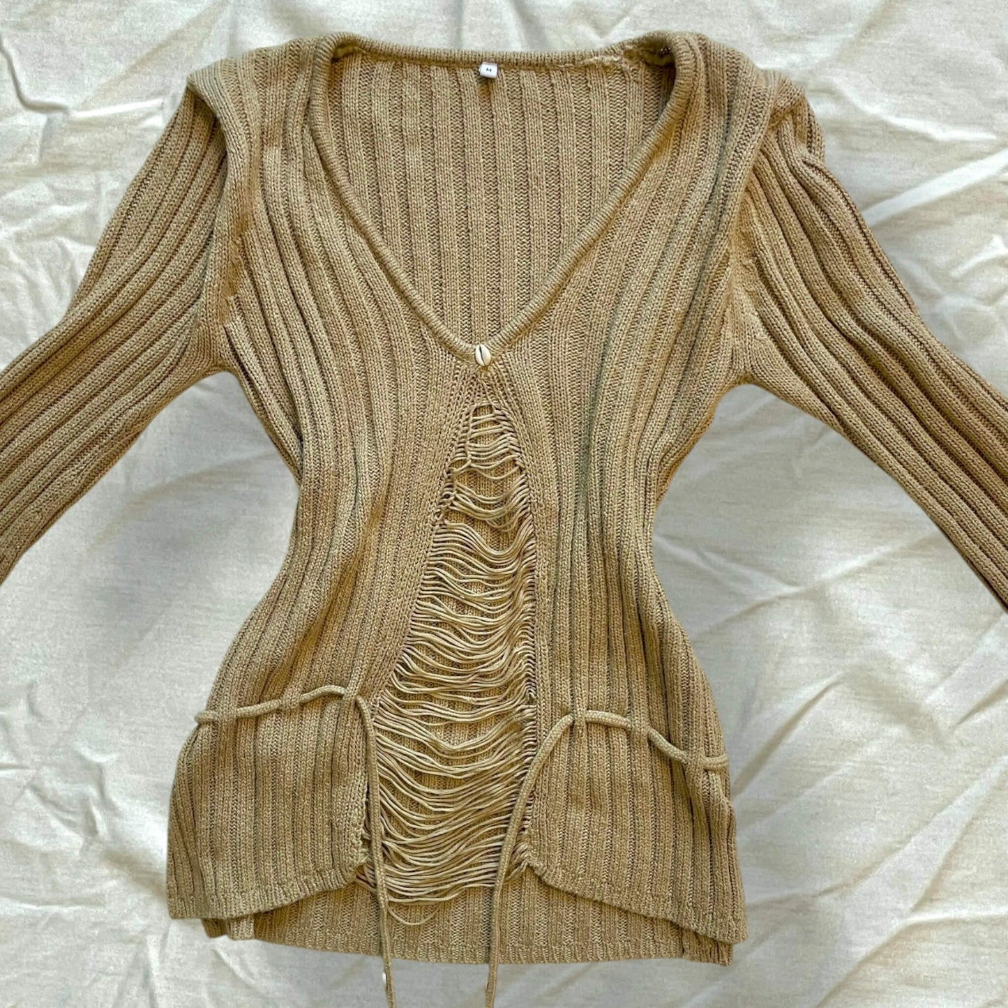 Pull beige coquillages